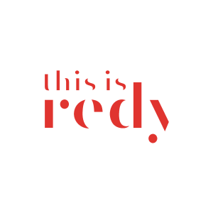 Logo cu textul 'this is redy' în culori roșii pe fundal negru.