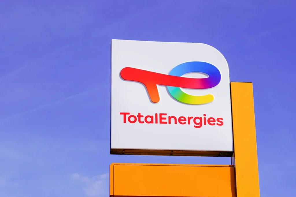 TotalEnergies logo against a blue background, symbolizing the Net Zero campaign.