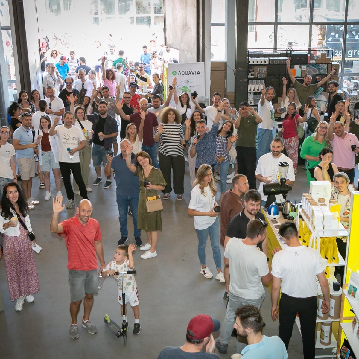 Enthusiastic crowd at Slow Coffee Festival supporting GoZero initiatives.
