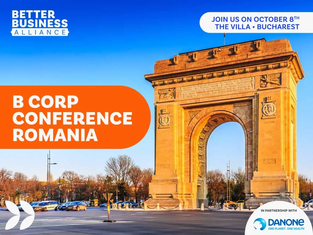 B Corp Conference in Romania with the Arch of Triumph in the background under a clear sky.